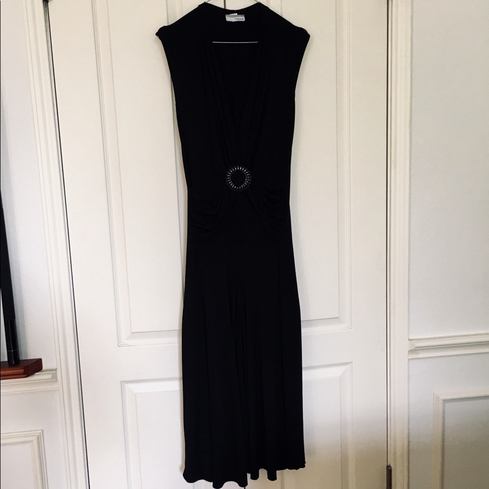 Long black dress with draped V-neck line